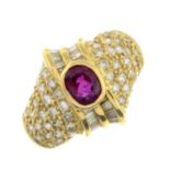 A ruby and vari-cut diamond dress ring.Estimated total diamond weight 0.80ct.Stamped 750.Ring size