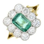 An emerald and brilliant-cut diamond cluster ring.Emerald weight 0.90ctTotal diamond weight