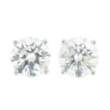 A pair of brilliant-cut diamond stud earrings.Estimated total diamond weight 2.10cts,