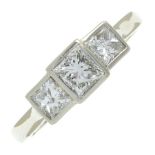 A platinum square-shape diamond three-stone ring.Estimated total diamond weight 1.40ct,