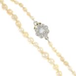 A natural pearl single-strand necklace, with old-cut diamond cluster clasp.