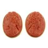 A pair of earrings, set with a coral cameo, each carved to depict a lady in profile.