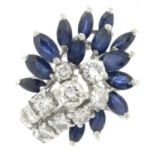 A brilliant-cut diamond and sapphire dress ring.Estimated total diamond weight 0.80ct,