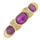 A ruby three-stone ring, with brilliant-cut diamond line spacers.Ring size L.