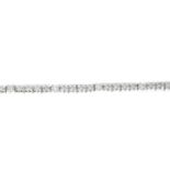 A brilliant-cut diamond line bracelet.Total diamond weight 0.89ct,