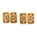 A pair of early 20th century 18ct gold enamel cufflinks.Stamped 18ct.