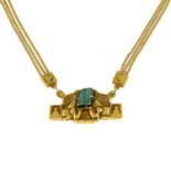 An abstract necklace, with rough emerald crystal highlight.