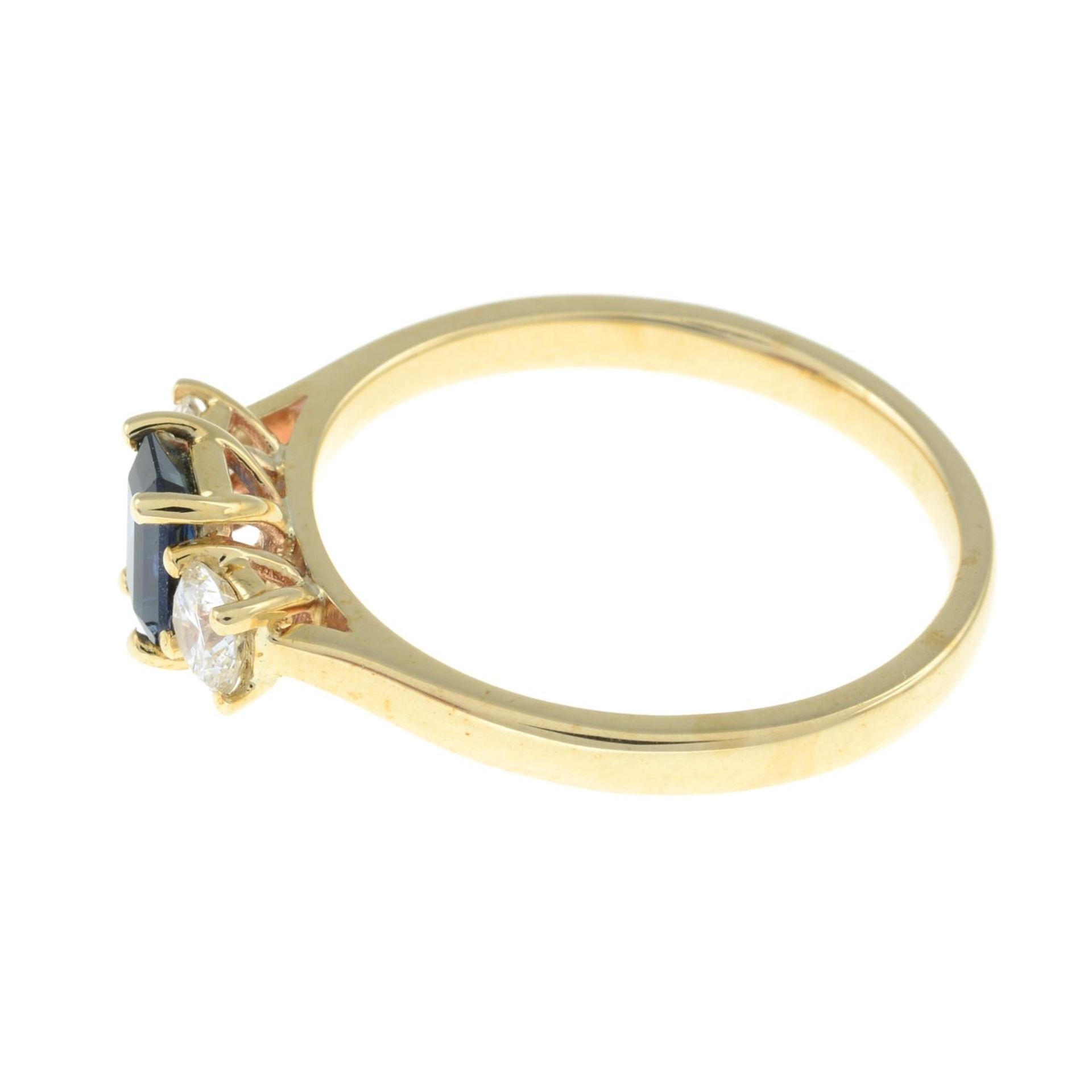 A 9ct gold sapphire and brilliant-cut diamond three-stone ring.Sapphire calculated weight 0.64ct, - Image 3 of 3