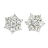 A pair of old-cut diamond cluster earrings.