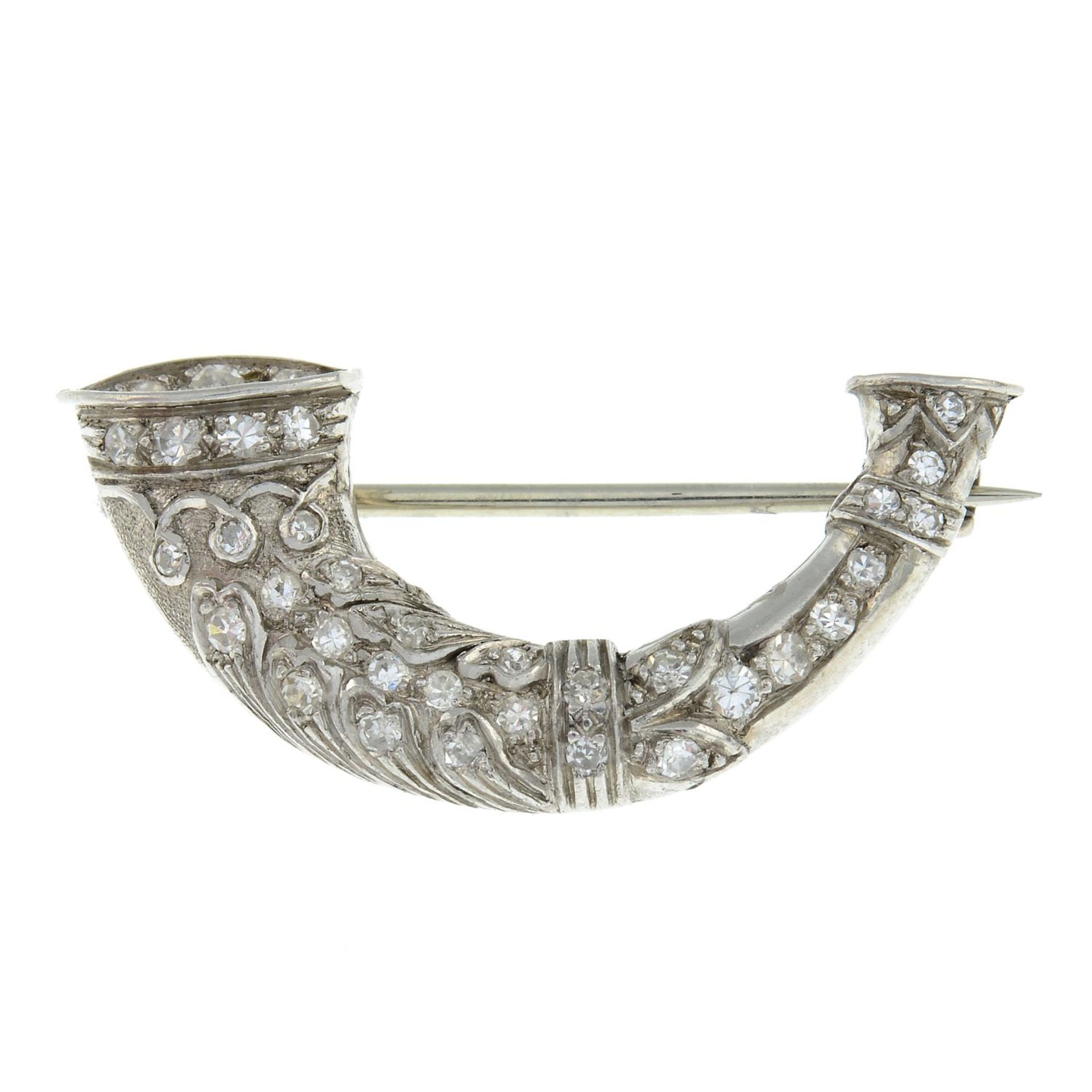 An mid 20th century old-cut diamond horn brooch.Estimated total diamond weight 0.30ct.Length