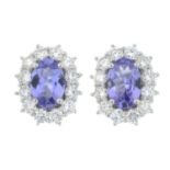A pair of 18ct gold tanzanite and brilliant-cut diamond cluster earrings.