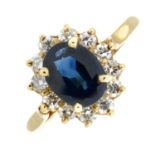 A 9ct gold sapphire and brilliant-cut diamond cluster ring.Sapphire calculated weight 1.33cts,
