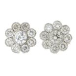 A pair of brilliant-cut diamond cluster earrings.Estimated total diamond weight 0.80ct.Length