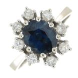 A sapphire and diamond cluster ring.