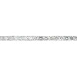 An 18ct gold brilliant-cut diamond line bracelet.Estimated total diamond weight 8cts,