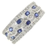 A sapphire and brilliant-cut diamond dress ring.Total sapphire weight 0.54ct.Total diamond weight