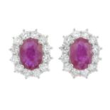 A pair of 18ct gold ruby and brilliant-cut diamond cluster earrings.Total ruby weight 1.75cts.