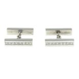 A pair of platinum brilliant-cut diamond cufflinks.