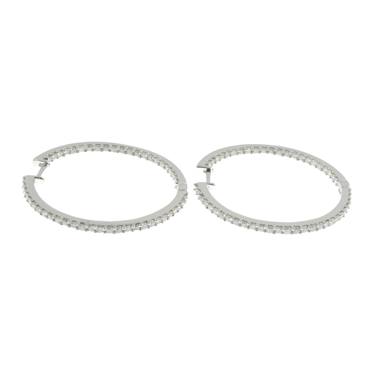 A pair of diamond hoop earrings. - Image 3 of 3