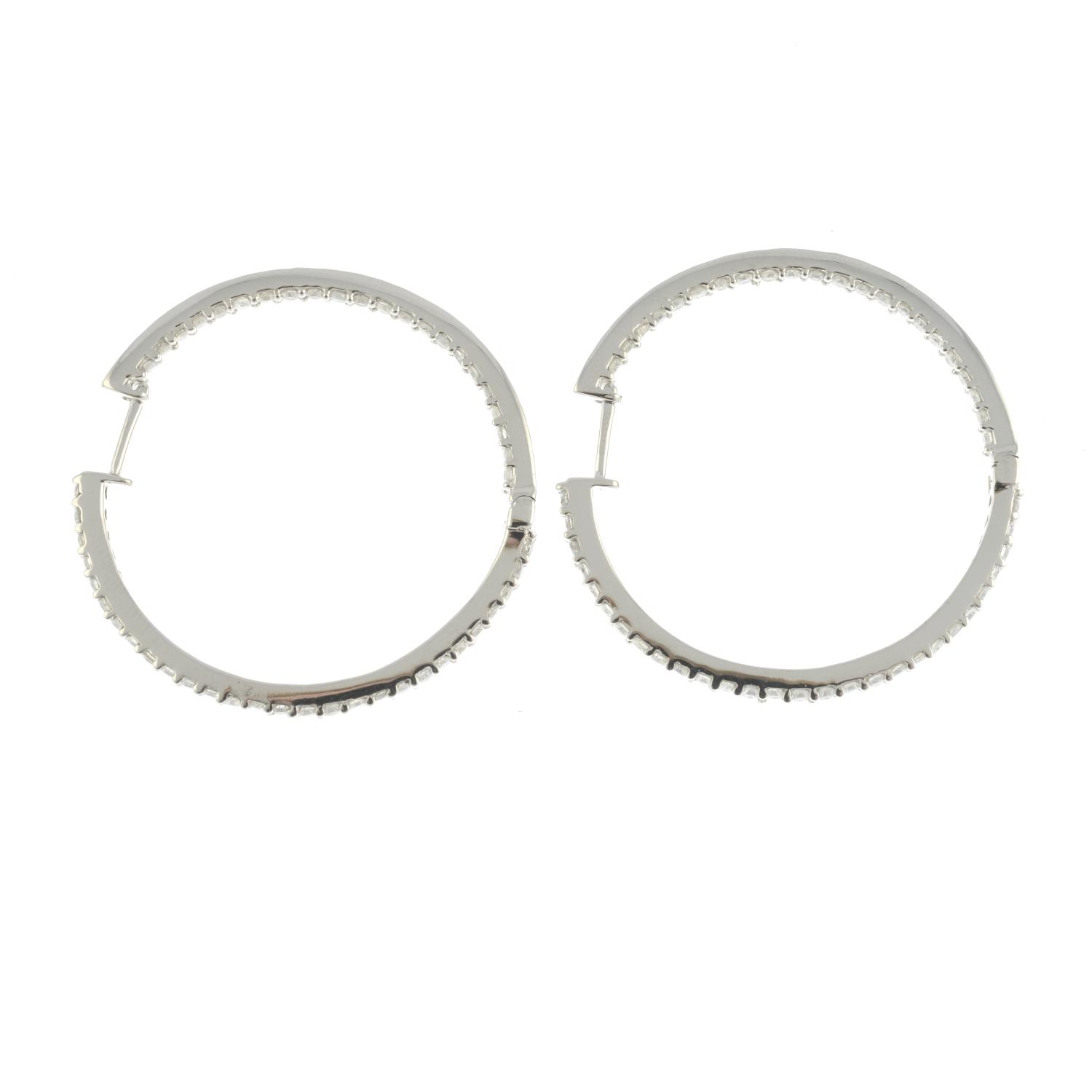 A pair of diamond hoop earrings. - Image 2 of 3