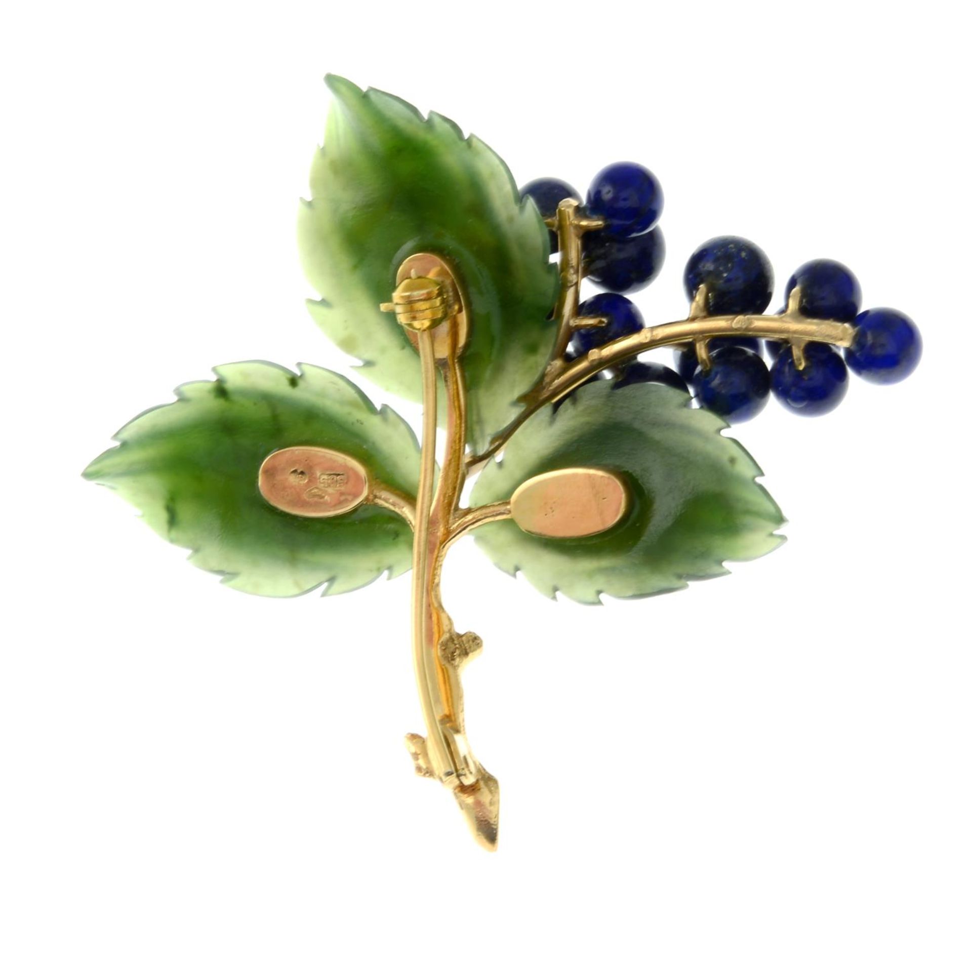 A brooch, with carved nephrite jade leaves, with lapis lazuli berries.Stamped 585.Length 5.2cms. - Image 2 of 2