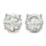 A pair of brilliant-cut diamond single-stone earrings.Estimated total diamond weight 0.80ct,