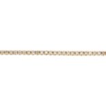 An 18ct gold brilliant-cut 'brown' diamond bracelet.Estimated total diamond weight 1.10cts,