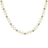 An emerald and brilliant-cut diamond necklace.Two emeralds deficient.Estimated total diamond weight