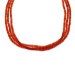 A fire opal three-row bead necklace, with fire opal cabochon push-piece clasp.Length 140.5cms.