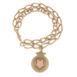 An early 20th century 9ct gold bracelet, suspending a 9ct gold medallion.Chain stamped 9ct.