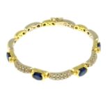 An 18ct bi-colour gold sapphire and brilliant-cut diamond bracelet.Total sapphire weight 2.96cts,