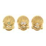 Three gold diamond and emerald shell dress studs, by Cartier.