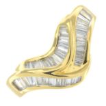 An 18ct gold tapered baguette-cut diamond chevron ring.Estimated total diamond weight 0.50ct.Import