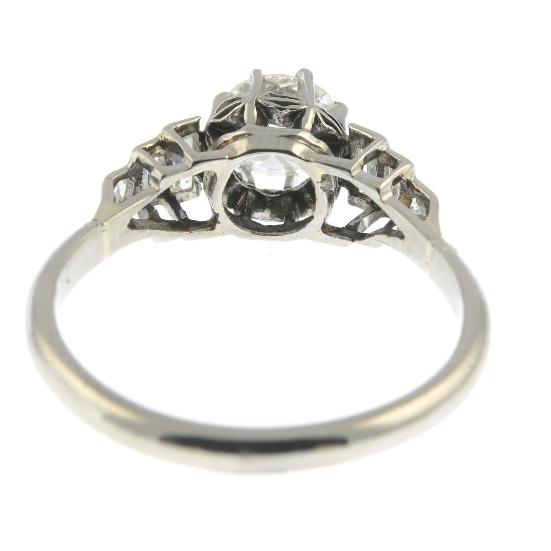 A mid 20th century platinum old-cut diamond single-stone ring, with vari-cut diamond shoulders. - Image 3 of 3