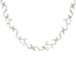 A brilliant-cut diamond scrolling necklace.Total diamond weight 2.49cts,