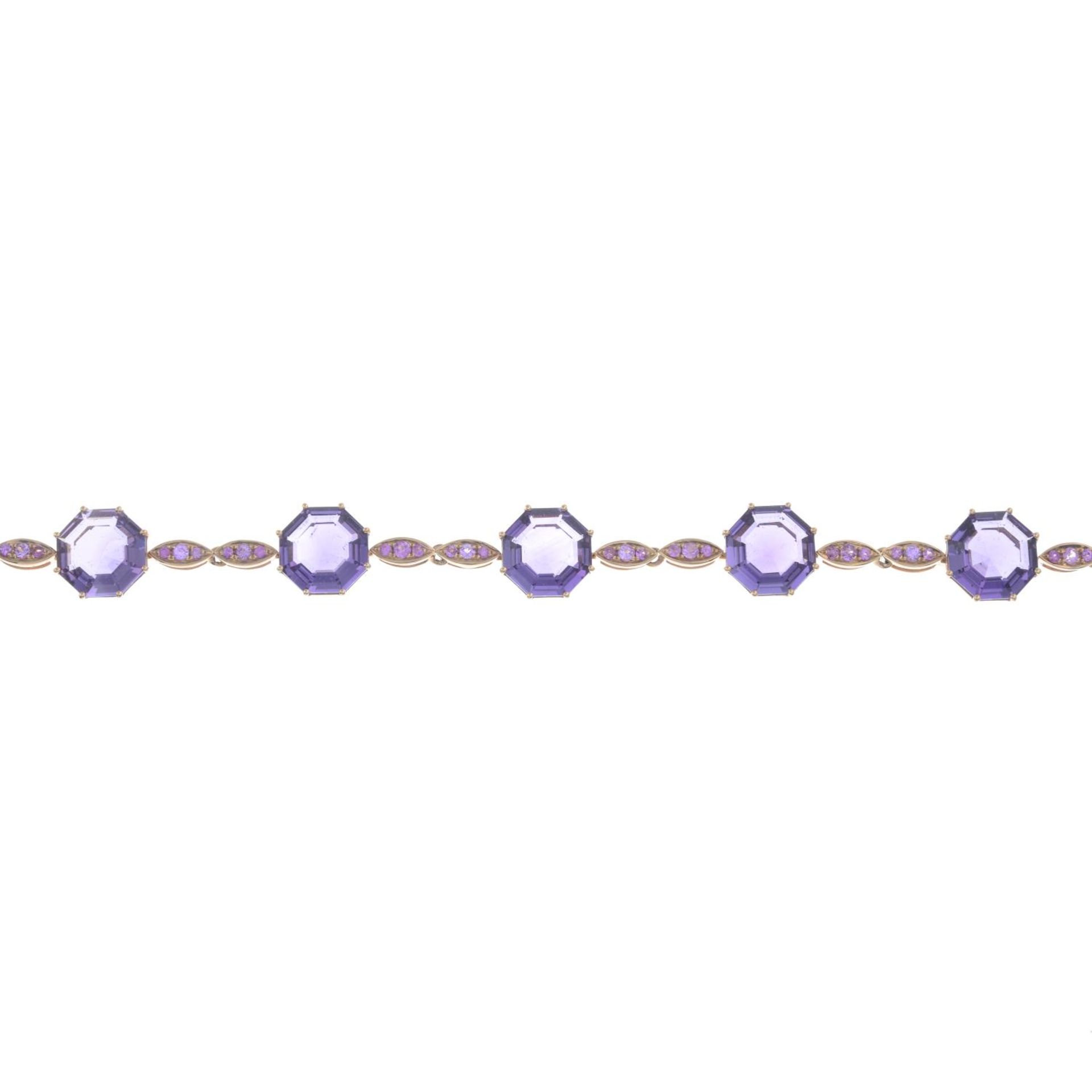 An 18ct gold amethyst and pink sapphire bracelet.Total amethyst weight 13.68cts,