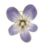 An early 20th century gold enamel and seed pearl pansy brooch.