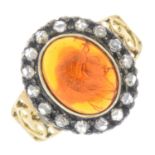 A fire opal cabochon and rose-cut diamond cluster ring.