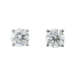 A pair of brilliant-cut diamond single-stone earrings.