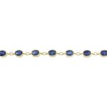 A 9ct gold sapphire bracelet.Total sapphire weight 11.88cts,