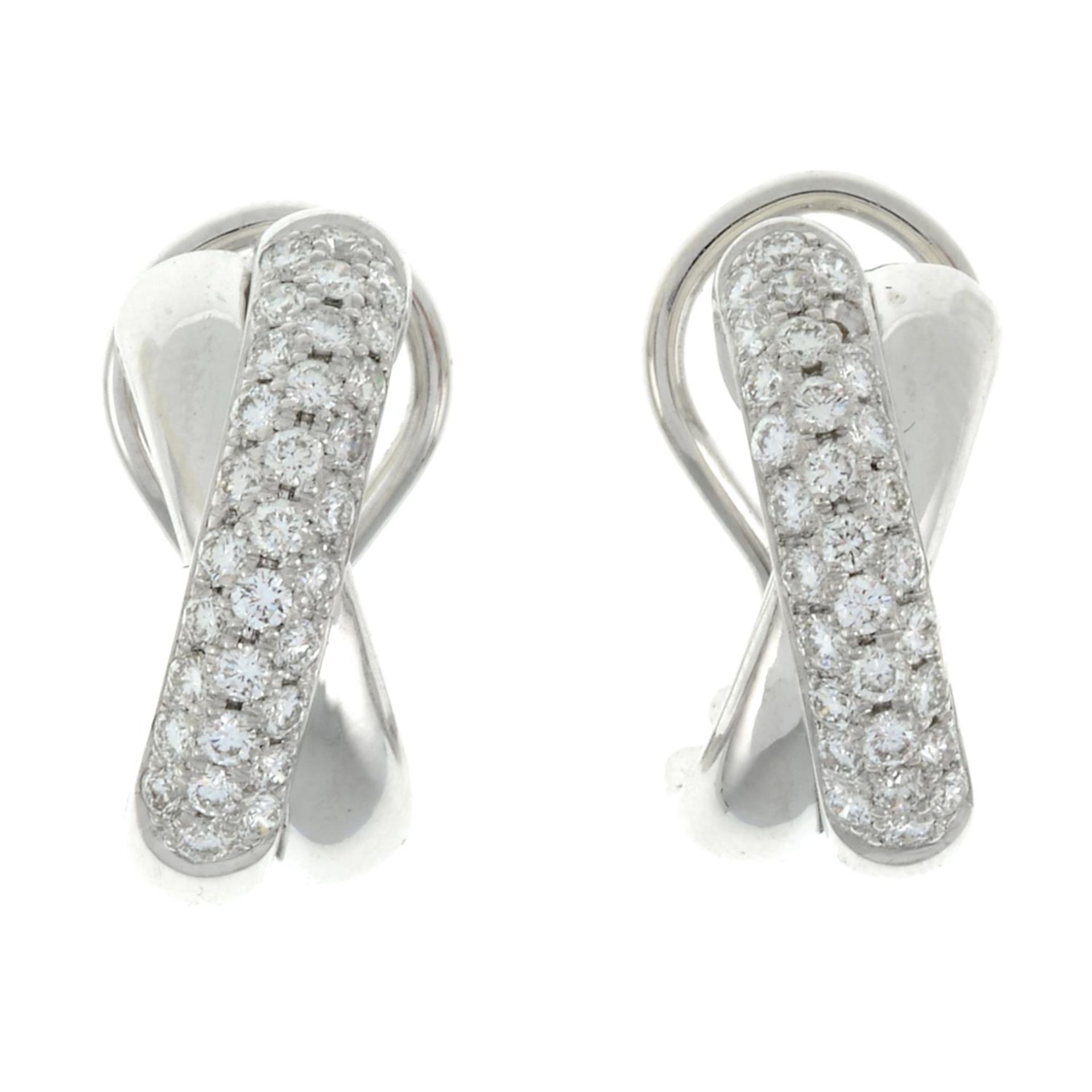 A pair of 18ct gold brilliant-cut diamond earrings.One diamond deficient.