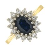 An 18ct gold sapphire and brilliant-cut diamond cluster ring.Sapphire calculated weight 1.30cts,