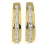 A pair of 9ct gold brilliant-cut diamond earrings.Estimated total diamond weight 0.70ct,