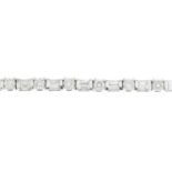 A vari-cut diamond line bracelet.Estimated total diamond weight 3.50 to 4cts,