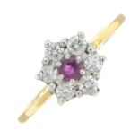 An 18ct gold ruby and brilliant-cut diamond cluster ring.Total diamond weight 0.33ct,