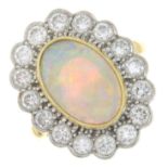 An 18ct gold opal and brilliant-cut diamond cluster ring.Estimated dimensions of opal 13 by 9 by
