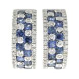 A pair of sapphire and brilliant-cut diamond hoop earrings.Estimated total diamond weight