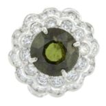 A zircon and brilliant-cut diamond floral cluster ring.Estimated dimensions of green zircon 10 by