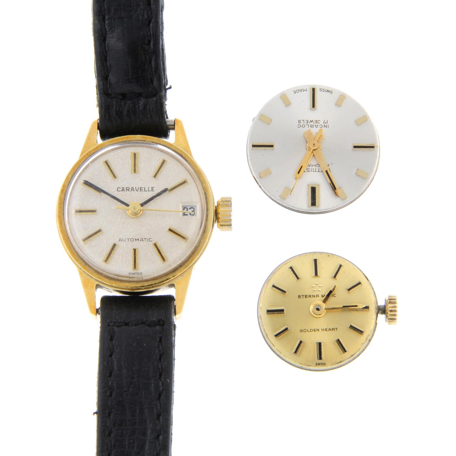 A small group of two watches and six watch movements,