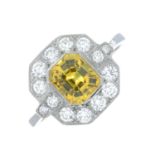 A yellow sapphire and brilliant-cut diamond cluster ring.Estimated total diamond weight